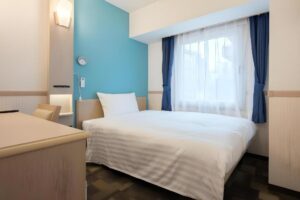 a room with a bed and a desk