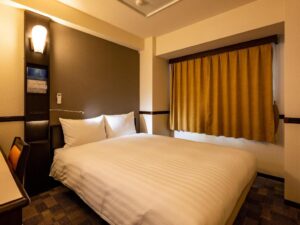 a small white refrigerator on a wooden surface