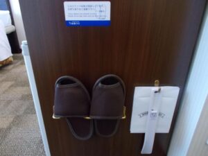 a pair of slippers on a door